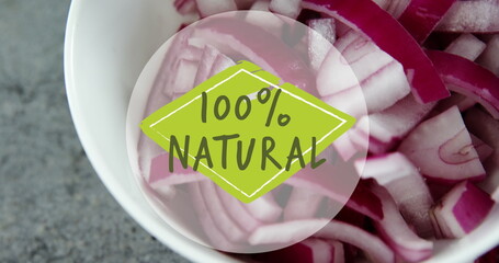 Image of 100 percent natural text over chopped red onions