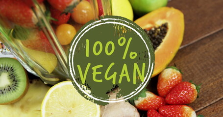 Image of 100 percent vegan text over fresh fruit