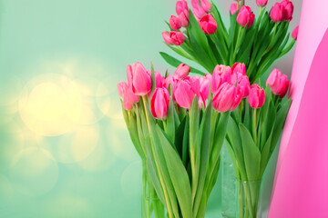 Bright spring festive background with pink tulips and a copy of the space. Bouquet of flowers.