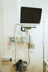 lood pressure, oxygen and EKG/EKC monitor screen in a patient room in a hospital