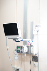 lood pressure, oxygen and EKG/EKC monitor screen in a patient room in a hospital