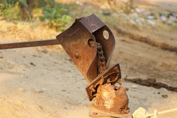 Bore well or known as hand pump in a rustic condition on outdoors. Abandoned hand pump exposed to sunlight