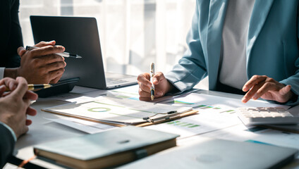 Team of business people are meeting to analyze data for marketing plan,Market research reports and income statistics, Financial and Accounting concept.