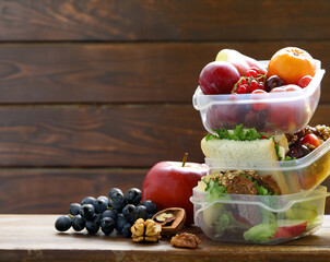 lunch box with fresh fruit and sandwich