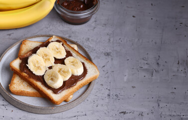 toast with chocolate spread and banana for breakfast