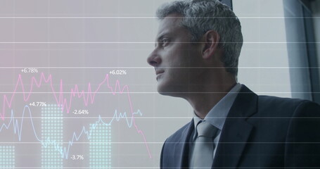 Image of financial data processing over caucasian businessman in office