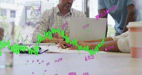 Image of multiple graphs, changing numbers over diverse coworkers discussing reports in office