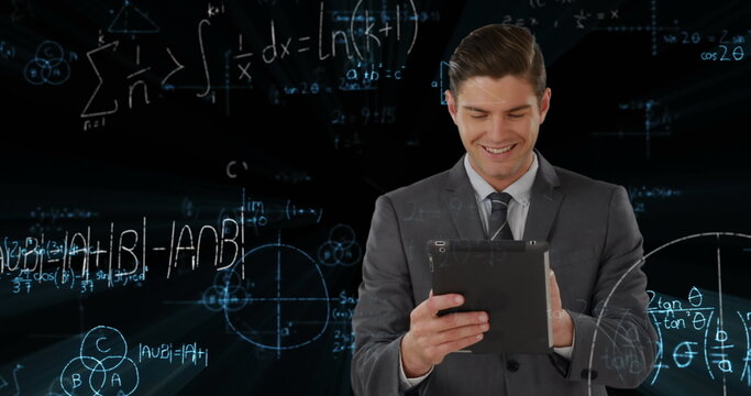 Image of data processing and mathematical equations over businessman using tablet
