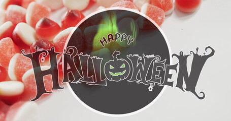 Obraz premium Happy halloween text banner against close up of candy corns on white surface