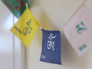 Tibetan Mantra flags, words Om Ma Ni Padme. Yoga, Meditation Buddhist style background