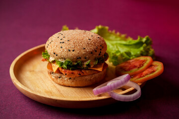 Burger served on a wooden plate with lettuce, onion, and tomato. social media post, food photography, fine dining, purple background, restaurant menu, fast food, junk food, street food, delicious