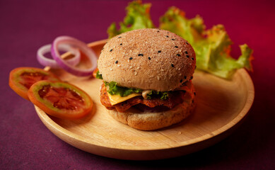 Burger served on a wooden plate with lettuce, onion, and tomato. social media post, food photography, fine dining, purple background, restaurant menu, fast food, junk food, street food, delicious