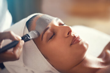 Facial, mask and cosmetic treatment for woman in spa for relax, wellness and beauty for break and...