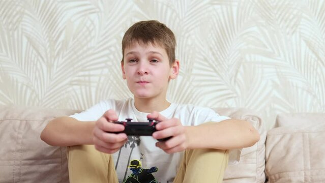 Young gamer managing PS. Home game console, modern technology, games, entertainment.