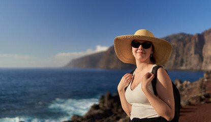 Young happy woman in Tenerife on the shore
