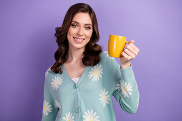 Photo of positive good mood woman wear flower print cardigan rising tasty beverage cup isolated purple color background