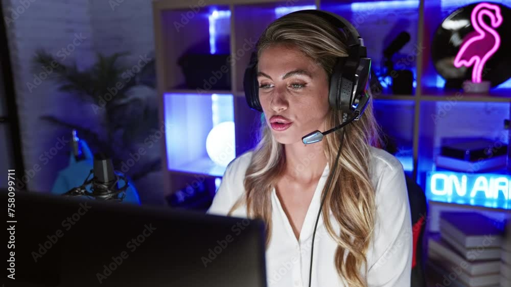 Sticker Young blonde woman streamer playing video game using computer speaking at gaming room