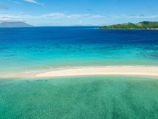 Bon Bon Sandbank with clear turquoise water and waves. Romblon Island. Romblon, Philippines.