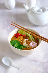 laksa ikan, asam laksa, rice noodle,vegetables, filet fish with sour soup, popular in penang, malaysia