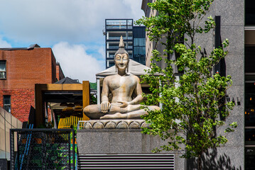 Montreal, Canada - July 6 2019: The Budha Statue in Montreal downtown