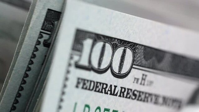 Macro view counter counting 100 bills american currency slow motion. Money concept. Save money for prepare in future. Bank automatic equipment for counting money close up. Cash money. 