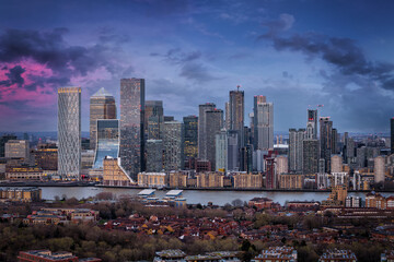 Panoramic view of the financial district Canary W´harf and the Docklands in London during dusk time