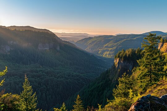 Golden Hour Over Reaction Canyon: A Breathtaking View of Valleys and Mountains under a Clear Blue Sky in Western Washington.