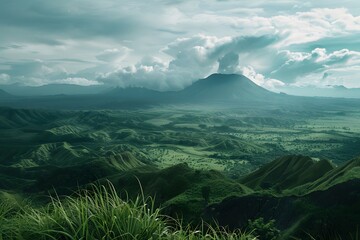 Cinematic capture of verdant hills with a distant volcano under dramatic lighting.