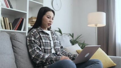 Sad asian young woman talk with psychotherapist at online distance remote counselling session indoors Depressed female discussing problem with psychological support by laptop computer at home