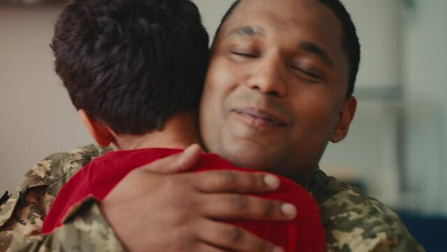 An African American military father comes back home, welcomed by his little son