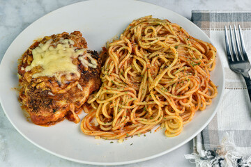 chicken parmesan  with  spaghetti  top with parsley