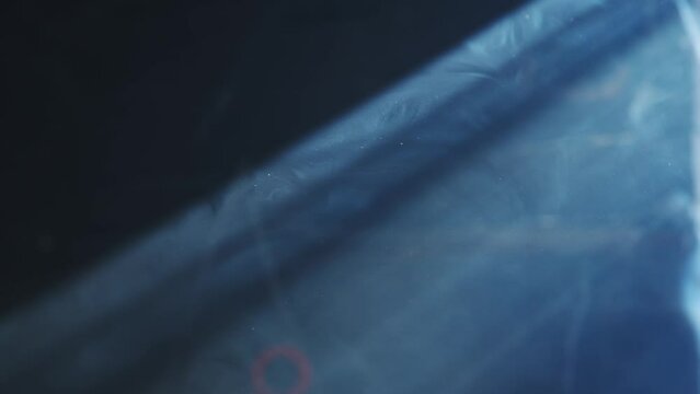 Supernatural bright beam of light fills the screen, the suns rays shine through the cracks, slow motion, camera movement