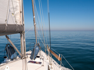 Sailboat on calm sea under clear sky, German Bight, North Sea near Jutland coast, Denmark
