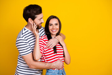 Naklejka premium Photo portrait of nice young couple hugging sweet relationship wear trendy striped outfit isolated on yellow color background