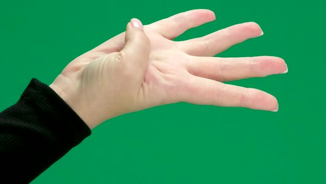 count on fingers to three 1 2, 3, Female hand on a green chromakey background space for text learning count decide choose
