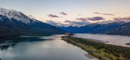 Road in Canadian Rocky Mountain Landscape. Sunrise Sky. Aerial Nature Background