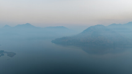 Lake panorama in a foggy morning. aerial view