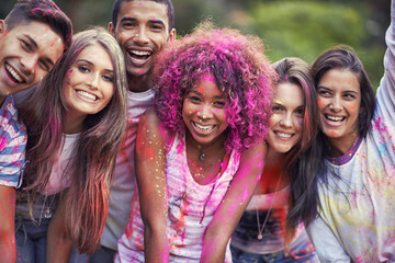 Friends, portrait and powder paint at color festival in park, happiness and fun with celebration or...