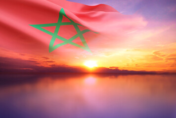 Flag of Morocco against the sunset. Background for National Holidays - obrazy, fototapety, plakaty