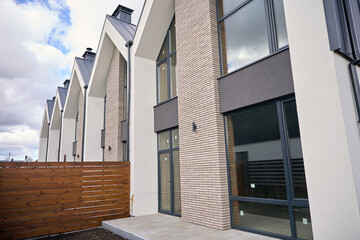 Fototapeta premium Two storey townhouses lined up next to another