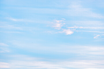 A beautiful sky tinted by the sun leaving vibrant shades of gold, pink, blue and multicolored. Clouds in the twilight evening and morning sky. Cloudy sky background in the evening and during the day.