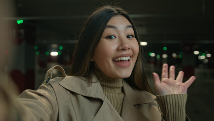 Webcam view POV happy smiling Asian woman girl chinese korean blogger vlogger influencer talking to...