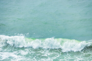 Wave splashing close-up. Crystal clear sea water, in the ocean in San Francisco Bay, blue water, pastel colors.