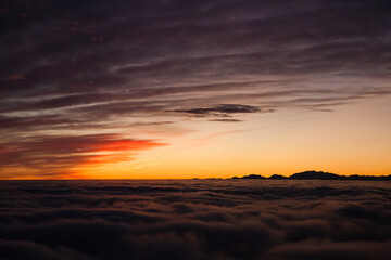 Spectacular sunset over a sea of clouds