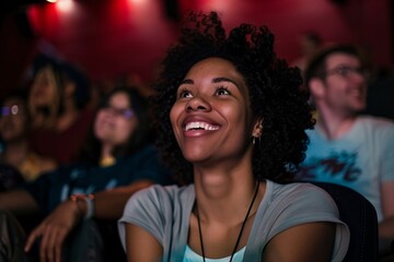 Black woman enjoying a movie with a big smile, completely engrossed in the cinematic experience - obrazy, fototapety, plakaty