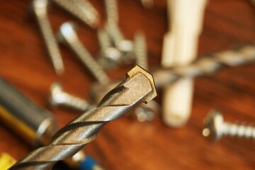 Drill with a special tip for holes in concrete and stone. Fragment of equipment for construction...