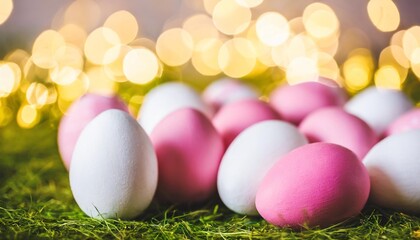 Fototapeta na wymiar easter background with pink and white eggs and bokeh lights
