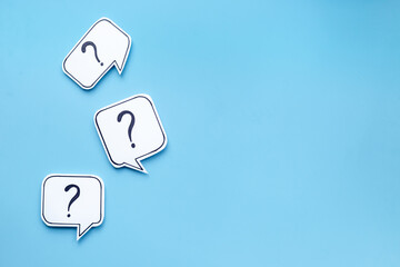 Question marks on paper speech bubbles. FAQ concept or search information concept