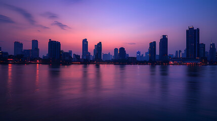 Fototapeta na wymiar A photo of the Bangkok skyline, with the Chao Phraya River in the foreground, during twilight