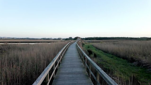 Wooden structure on the footbridges of Barrinha de Esmoriz with water from the Paramos lagoon, Portugal.
